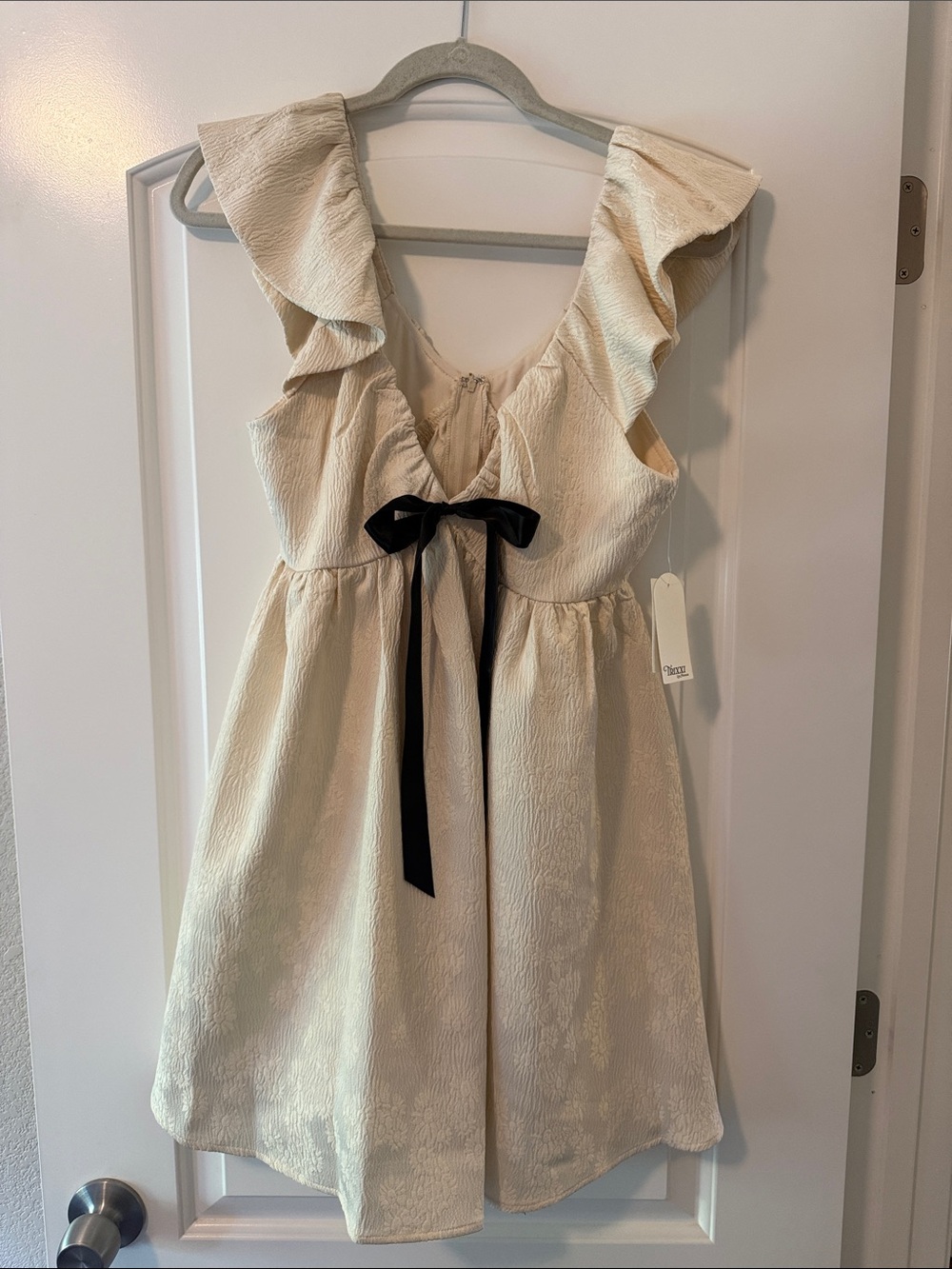 Trixxi Cream Ruffle-Shoulder Dress with Black Bow